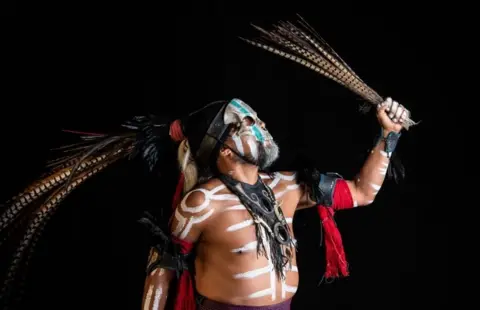 AFP Mexican dancer Jorge de Jesus Trujillo, who represents "Mictlantecuhtli" (deity of the dead in the Mexica mythology) in the pre-Columbian ballgame Ulama poses for a photograph in Mexico City on 21 August, 2019.