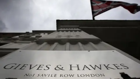 Getty Images Union Jack flies above Gieves and Hawkes at No 1 Saville Row, London