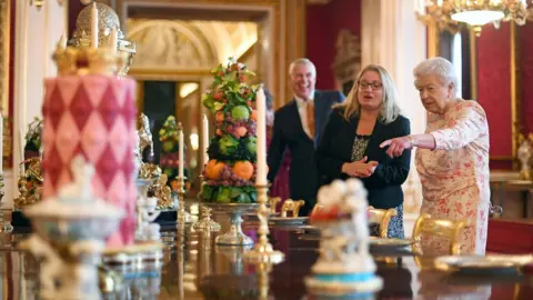 Getty Images The Queen looks around the exhibition at Buckingham Palace