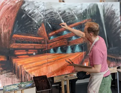 Peter Keegan Peter Keegan painting at the theatre