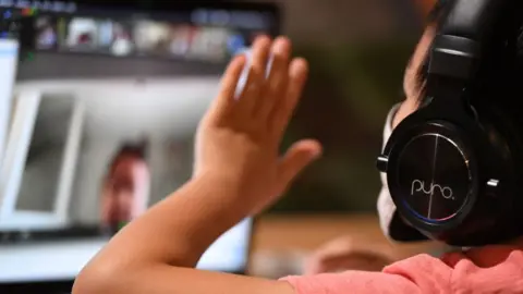 Getty Images A child taking part in an online lesson.