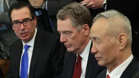 Getty Images U.S. Secretary of the Treasury Steven Mnuchin (2nd L) speaks as U.S. Trade Representative Robert Lighthizer (3rd L) and U.S. Secretary of Commerce Wilbur Ross (L) listen during a meeting between U.S. President Donald Trump and Chinese Vice Premier Liu He (R) in the Oval Office of the White House February 22, 2019 in Washington, DC.