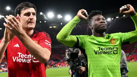 Andre Onana and Harry Maguire of Manchester United