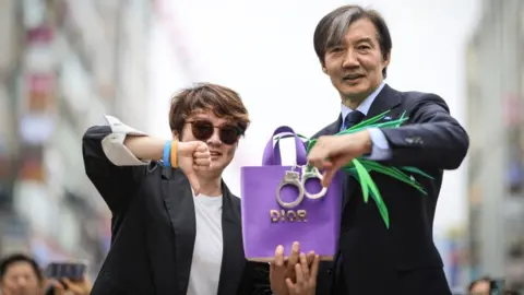 Rebuilding Korea Party An opposition leader, Cho Kuk, campaigning with a Dior handbag and spring onions