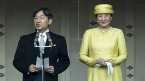 Getty Images Japan's Emperor Naruhito addresses as Empress Masako looks on from the balcony of the Imperial Palace on May 04, 2019 in Tokyo, Japan