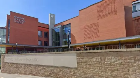 Google Sheffield Children's Hospital - a large red-brick building, with a clock tower between two wings