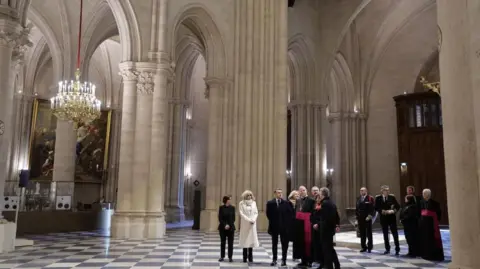 EPA French President Emmanuel Macron (C) and and first lady Brigitte Macron (C-L) during a visit of Notre-Dame de Paris cathedral in Paris, France, 29 November 2024. 