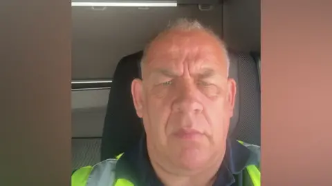 Supplied A close up selfie of a man wearing hi-vis taken in a lorry cab