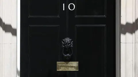 Getty Images The black door of 10 Downing Street, with its brass letter box labelled 'First Lord of the Treasury'