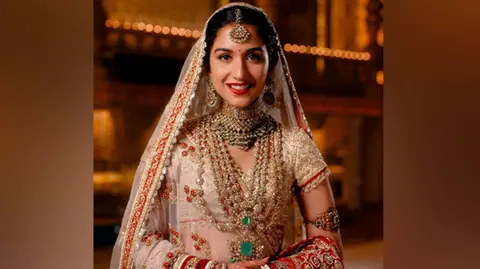 ANI Radhika Merchant smiles in a photoshoot before the wedding