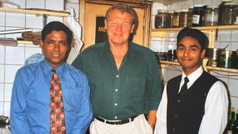 Luthfur Rahman with his father and the late Lord Paddy Ashdown in his restaurant kitchen