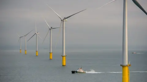 Rampion Wind turbines out at sea on a calm day.