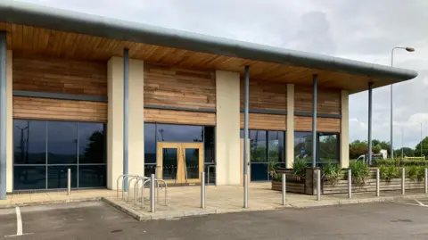 James Grant/BBC The vacant retail unit