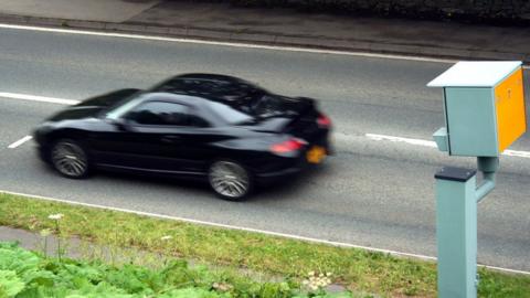 A car passing a speed camera