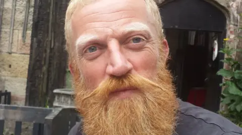 Liz Saville-Roberts Close-up of Paul who has short cropped sandy hair and a long red beard.