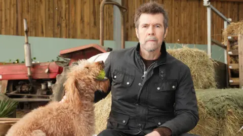 UKTV/Ollie Upton Rhod Gilbert and his dog, Piscen