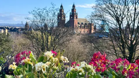 The towers of Kelvingrove gallery with flowers in the foreground