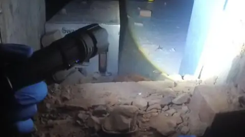 Nottinghamshire Police View through hole in wall at warehouse