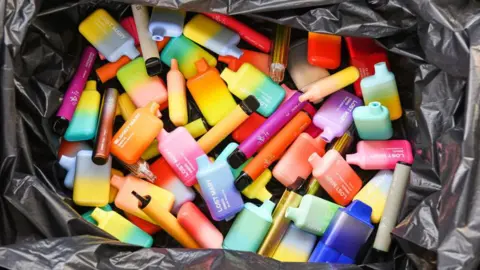 Getty Images Discarded disposable vapes in a bin