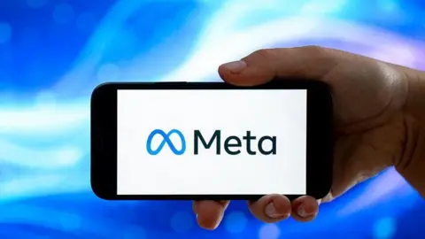 A phone with a white background and a black Meta logo beside a blue graphic.