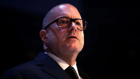Jony Ive in glasses presents the Fashion Icon award on stage during The Fashion Awards 2019 held at Royal Albert Hall on December 02, 2019 in London, England. 