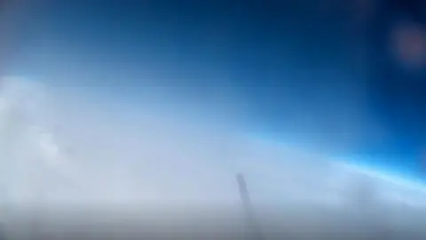 Walhampton School White clouds and the curve of earth from weather balloon footage.