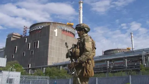 AFP Russian soldier on guard at Zaporizhzhia nuclear plant, 1 May 22