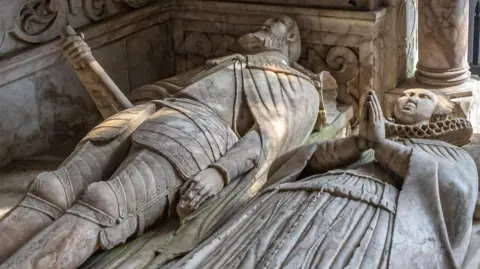 Bradgate Park Trust Grey effigies of a man and a woman lying on their backs