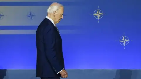 EPA US President Joe Biden takes the stage for a family photo during the NATO 75th Anniversary ceremony