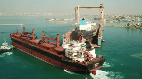 Shutterstock A cargo ship being repaired after being attacked in the Red Sea