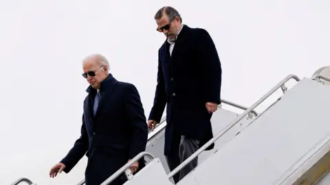 Reuters Joe Biden and Hunter Biden deplane from Air Force One in 2023