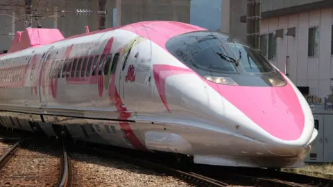 AFP A Shinkansen train adorned with special livery bearing popular character Hello Kitty