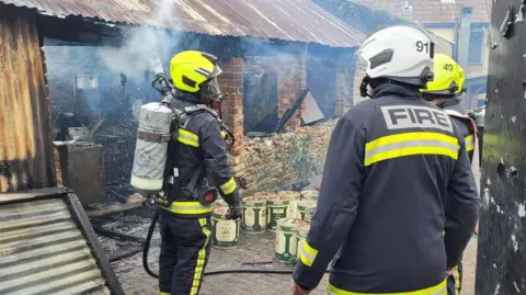 Jennie Bruton Close up of firefighters at the scene