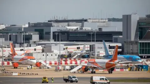 Getty Images Planes on the runway at Gatwick Airport.