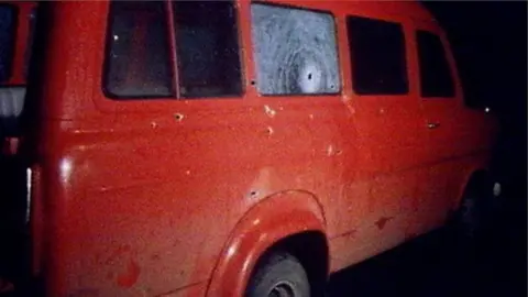 BBC Minibus with bullet holes