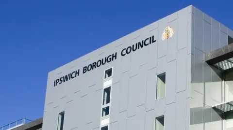 Ipswich Borough Council A grey block building with the words Ipswich Borough Council written on it