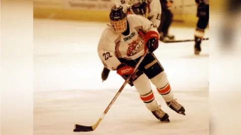 BBC Tom playing ice hockey