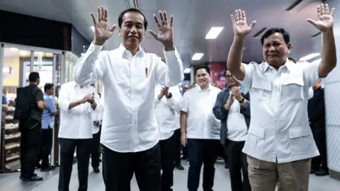 NurPhoto Jokowi And Subianto meet at a subway station in July - first time since the bitter election