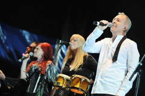 Getty Images The B-52s pictured in concert in 2019