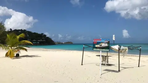 BBC An empty beach in Barbuda