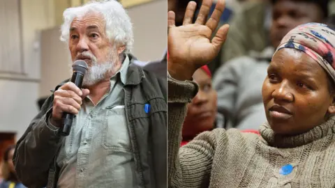 AFP Two people at one of the land hearings in South Africa