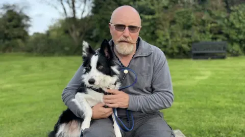 Ben Wilkes with a border collie