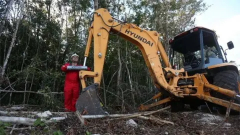 EPA Activists of Greenpeace chain themselves to backhoes against the construction of section 5 of the Maya Train in Playa del Carmen, Quintana Roo state, Mexico, 28 March 2022.