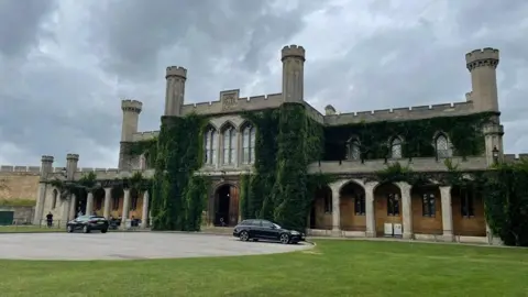 BBC An exterior photo of Lincoln Crown Court, a castle building with arches and columns, covered in dark green ivy.