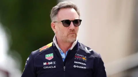 PA Media Christian Horner wears Red Bull jacket and sunglasses