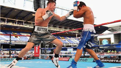 Getty Images Callum Smith lands a left shot on Cesar Hernan Reynoso