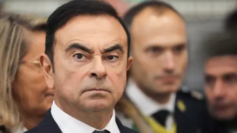 Getty Images Chairman and CEO of Renault-Nissan-Mitsubishi Carlos Ghosn looks on during a visit of French President at the Renault factory, in Maubeuge, northern France, on November 8, 2018.