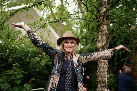 PA Media Dame Joanna Lumley poses for a photograph, during the RHS Chelsea Flower Show press day, at the Royal Hospital Chelsea, London. Picture date: Monday May 22, 2023.