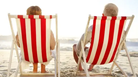 Getty Images Retired couple sitting in deckchairs