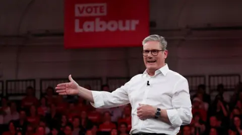 Reuters Labour leader Sir Keir Starmer speaking on stage at a campaign event